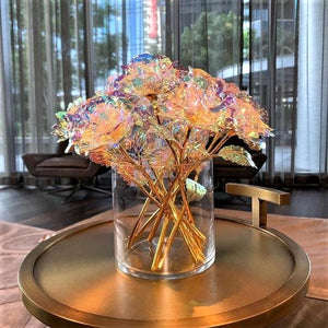 A whole bouquet of Galaxy Roses in a vase on a table