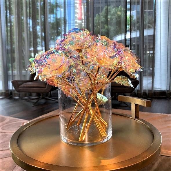 A whole bouquet of Galaxy Roses in a vase on a table