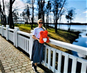 two rose bears, one small one big on white background